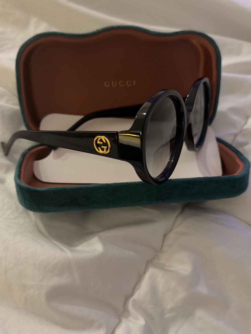 Gucci Black Round Sunglasses with Gold Logo Accent